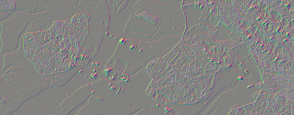 A combined edge detection RGB. Sobel vertical and horizontal are displayed as red and green, a 5x5 highpass filter is displayed as blue.